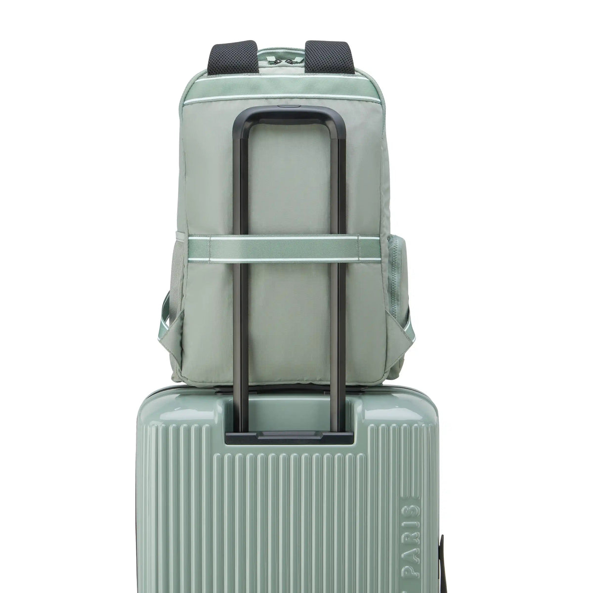 Florence by Mills Carefree Carry Sage Green backpack on rolling luggage